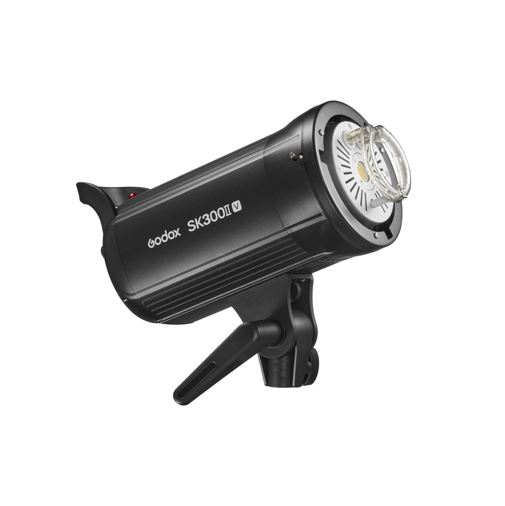 The Godox SK300II-V studio strobe lamp with black cylindrical body, mounting bracket and flash tube visible from the front is visible against a white background.