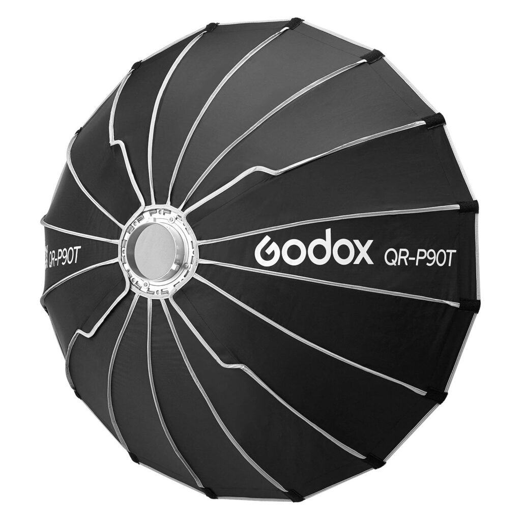 1709019449_372 The Godox Quick Release Parabolic Softbox for livestreaming QR-P90T is a large, black, umbrella-style softbox with silver ribs and centre section, designed for professional photography.