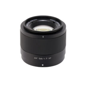 1710933420_780 The Viltrox AF 56mm f/1.7, Fuji X lens stands upright on a white background and features a black body with a ribbed focus ring and visible glass elements on top.