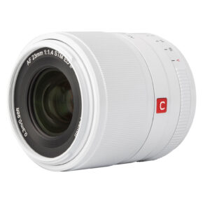 1712578056_876 A close-up of the Viltrox AF 23mm f/1.4 lens, Fuji X (Limited Edition White) shows the AF 23mm 1:1.4 STM ED IF on the front, the textured focus ring and the red C button on the side.