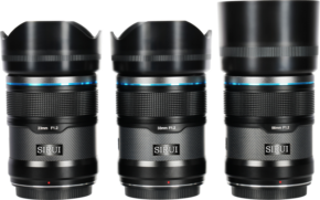 800q-01_126746 Three Sirui Sniper lenses – 23mm, 33mm and 56mm f/1.2 AF (E-mount, Black) - are shown side by side against a white background, with the 56mm model featuring a longer lens hood.