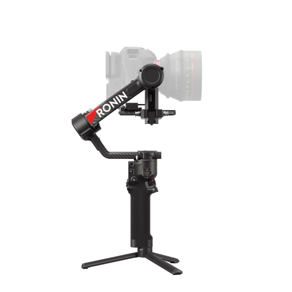 HG704-左侧 The black DJI RS 4 gimbal handheld camera stabilizer with semi-transparent camera sits on a foldable stand against a white background.