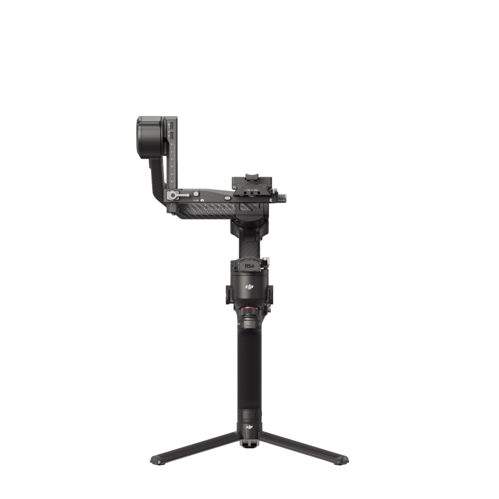 HG704-正面无相机 The DJI RS 4 gimbal, a handheld black camera gimbal with a camera mounted on it, stands upright on its stand against a white background.