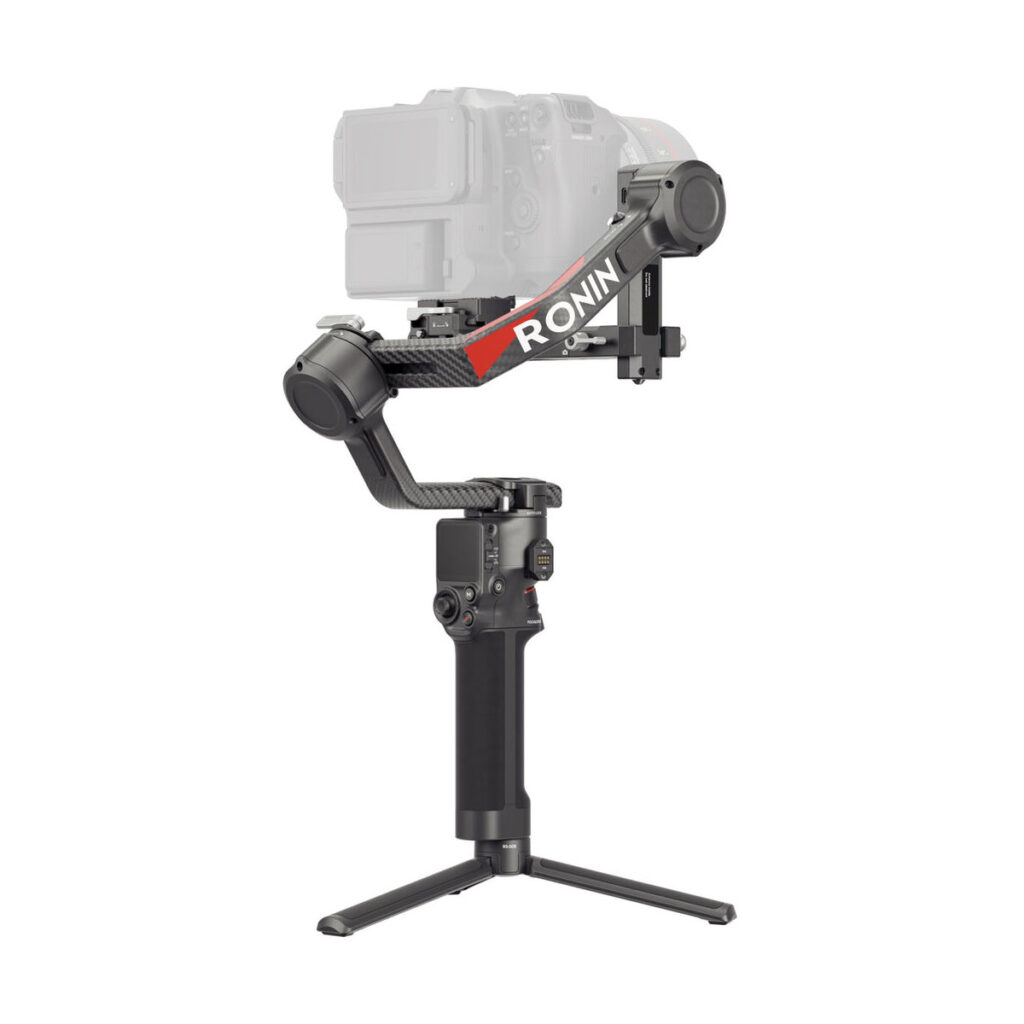 Black DJI RS 4 Pro gimbal handheld camera gimbal with red RONIN marking, pictured with the semi-transparent camera mounted on top and a small tripod on its base.