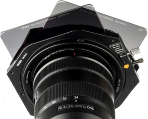 800q-01_112606 Close-up of Sony FE 24-105mm f/4 G OSS lens with NiSi Switch Filter Holder 100mm filter holder with three overlapping rectangular filters at different angles.