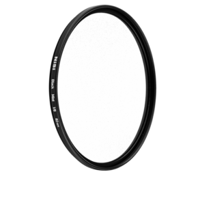 800q-01_116575 Round NiSi filter Black Mist 1/2 52mm diffusion filter with black metal frame stands upright against a white background. The filter size, 52mm, is marked on the edge.