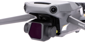 800q-01_118277 A close-up of the Nisi Filter For Mavic 3 ND4 filter, attached to a grey DJI Mavic 3 drone, highlighting its camera, gimbal and part of the arm against a white background.