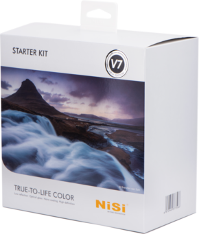Valkoisessa laatikossa, jossa on NiSi Starter Kit 100mm System V7 -merkintä, on maisemakuva joesta ja vuorista, teksti "V7" ja "True-to-Life Color", ja NiSi-brändi on painettu keltaisella oikeaan alakulmaan.