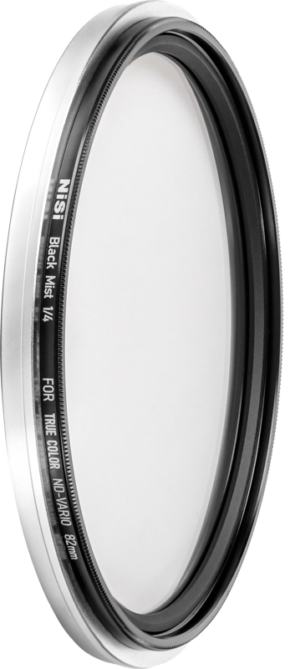 800q-01_121348 Close-up of a circular camera lens filter marked NiSi Filter Swift System Black Mist 1/4 67mm diffusion filter with a thin black and silver metal frame.