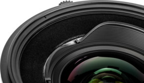 800q-01_125122 Close-up of the NiSi Filter Holder S6 Adapter for Sigma 14mm f/1.4 DG DN, highlighting its textured black rings, intricate adapter details and reflections on the adapter surface (adapter only) - disc filter holder.
