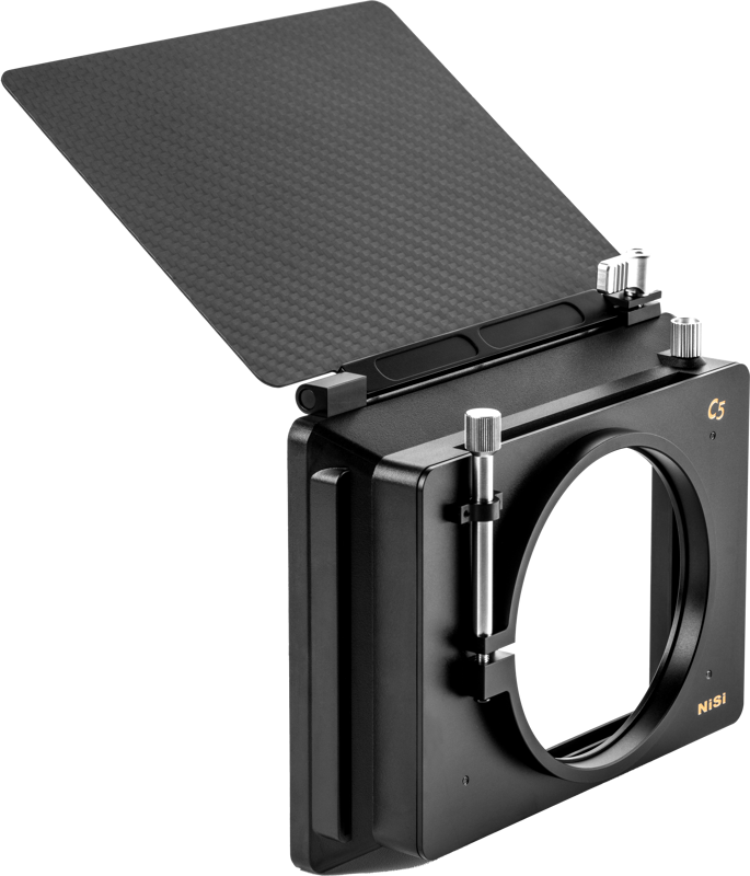 800q-02_122387 The NiSi Matte Box C5 Filmmaker Kit is a black rectangular camera filter holder with a large circular opening and a carbon fibre top flange, designed for use with filters and lenses.