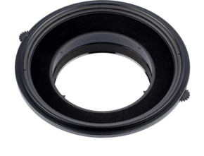 800q-05_115191 Close-up of the NiSi Filter Holder S6 Kit Landscape for Canon TS-E 17mm f/4, a black, circular adapter with two knobs for attaching the filters to the camera lens, against a white background.