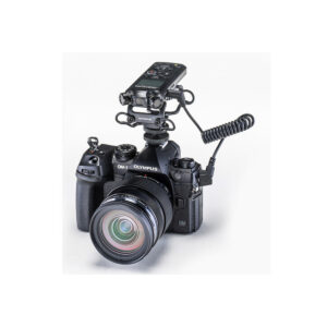 LS-P52 An Olympus OM-D digital camera with a large lens and an OM SYSTEM LS-P5 audio recorder mounted on top with a coiled cable against a white background.