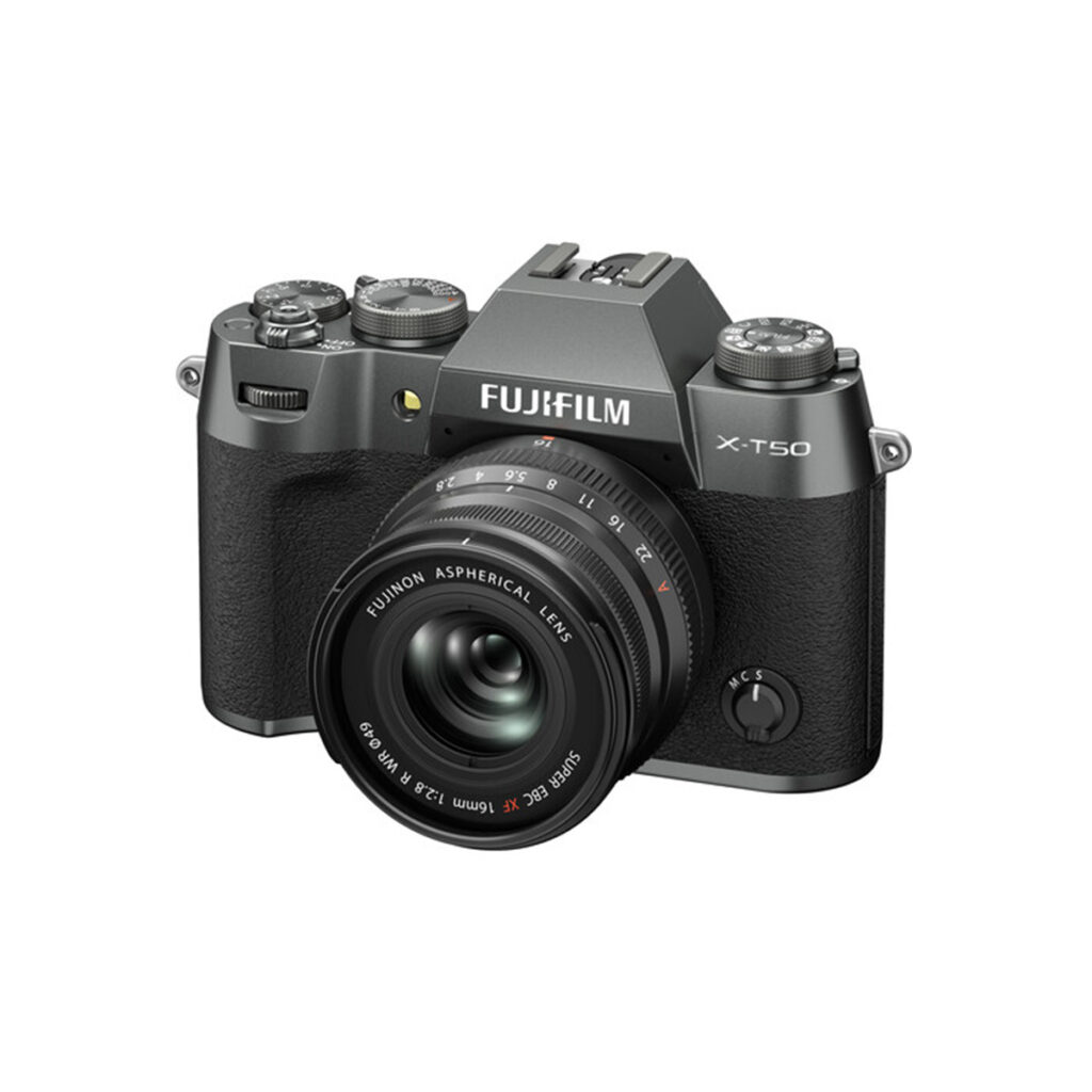 X-T50CS8 A Fujifilm X-T50 system camera, grey, is visible from the front right on a white background with a Fujino aspherical lens attached.