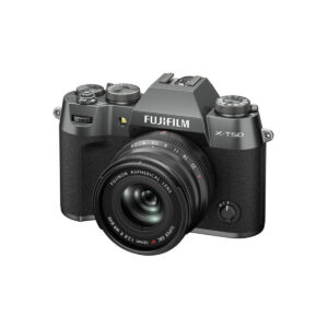 X-T50CS8 A Fujifilm X-T50 system camera, grey, is visible from the front right on a white background with a Fujino aspherical lens attached.