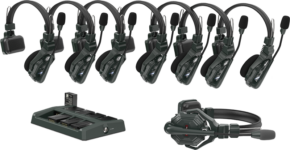 Eight Hollyland Solidcom C1 wireless intercom headsets are lined up above the battery charging station, with one lying on its side.