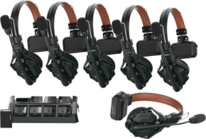 Six Hollyland Solidcom C1 Pro Wireless Intercom System ENC headsets with brown headbands are lined up, with a charging station in front that holds four batteries and one headset separately.