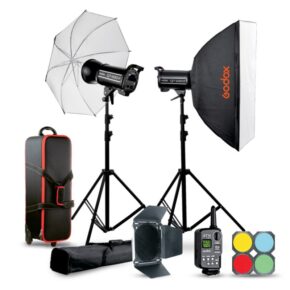 1664794965_191 The Godox QT400IIM-C Duo studio kit is shown on a white background with two light stands and mounted lights, umbrella, softbox, carrying case, control unit, colour gels and barndoor mount.