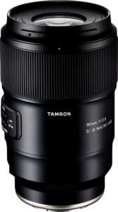 01_129111-2 The Tamron 90mm f/2.8 Di III Macro VXD lens for the Sony E is shown upright on a white background, with the brand name and specifications clearly visible on the barrel.