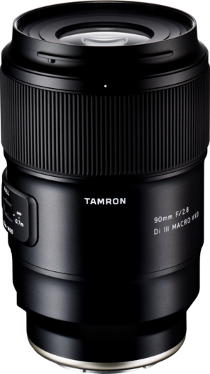 01_129111-2 The Tamron 90mm f/2.8 Di III Macro VXD lens for the Sony E is shown upright on a white background, with the brand name and specifications clearly visible on the barrel.