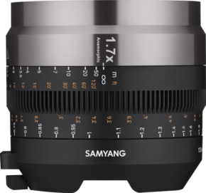 800q-01_127834 Close-up of a Samyang V-AF Anamorphic Adapter lens with 1.7x compression ratio, showing detailed white and orange focus and aperture markings on a black barrel.