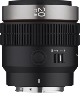 800q-01_127883 A close-up of the Samyang V-AF 20mm T1.9 - Sony FE lens shows the black grooved focus rings, the metal mount and the side switch marked M1 M2.