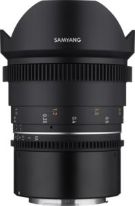 800q-19_115741 A close-up of the Samyang 14mm T3.1 VDSLR MK2 for Canon RF lens shows its black body, textured focus and aperture rings, white and orange distance markings and petal-shaped hood.