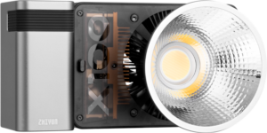 800q-01_123617 A close-up of the Zhiyun LED Molus X100 COB Light Combo shows its metal housing, exposed heat sink and large textured reflector with a central LED bulb.