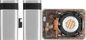 800q-01_127516 Three views of Zhiyu's LED Molus X60 RGB Pro Cob Light, a compact rectangular fixture with a metal body, black accents, a circular illuminated component and a visible internal circuit on one side.