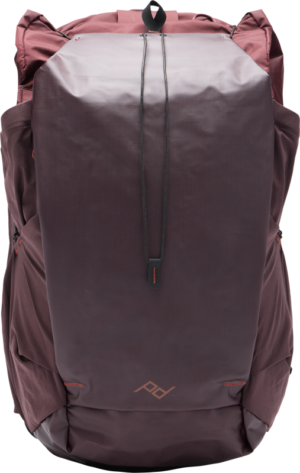 The Peak Design Outdoor Backpack 45L - Eclipse features reddish brown and dark purple colours, a stylish angular design, top handle, side pockets and a subtle front logo.