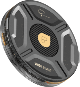 800q-03_129548 Close-up of the PolarPro Helix 6-9 Stop PMVND / Mist Filter, a black and gold circular lens filter with textured grooves, gold logo and signature at the top, marked VND 6-9 MIST.