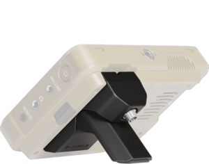 The black ATOMOS Battery Eliminator Stand for Ninja attaches with a screw to the back of the small, light-coloured device. Visible ports marked MIC/LINE and REMOTE are visible from the rear in a diagonal view.