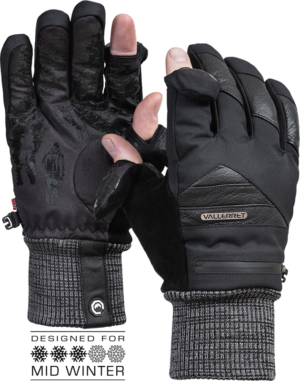 A pair of black Vallerret Markhof Pro V3 photo gloves (XS-Slim): one shows the palm with a textured grip, the other the back of the hand with the thumb and index finger tips turned open to reveal the bare fingers. Text: designed for mid-winter.