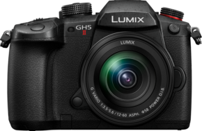 800q-01_116688 Front view of the Panasonic Lumix GH5 II digital camera with 12-60mm f/3.5-5.6 lens attached, showing the black body and visible buttons and controls.