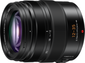 800q-01_122381 The close-up of the Panasonic Leica DG Vario Elmarit 12-35mm f/2.8 ASPH Power O.I.S. lens shows black textured adjustment rings with illuminated orange and white zoom and focus markings indicating focal lengths and specifications.