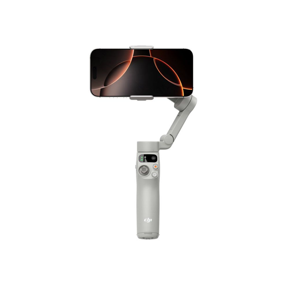 1080x1080_Osmo Mobile 7-5 The smartphone is attached to a grey DJI Osmo Mobile 7 handheld gimbal stabilizer against a white background. The phone's screen has a dark background image with orange curved lines.