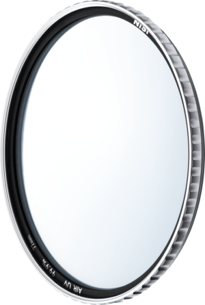 800q-01_130626 The round camera lens filter with silver brushed edge and clear glass, marked NiSi Filter Pro Nano AIR UV 37mm UV filter, is visible against a light background.