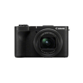 Musta Canon PowerShot V1 kompaktikamera, jossa on suuri etulinssin objektiivi ja Canon-logo oikeassa yläkulmassa, valkoista taustaa vasten.