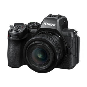 The Nikon Z5 II with the Nikkor Z 24-50mm f/4-6.3 lens, shown in black from the left front, shows buttons, dials and the Nikon logo. Includes 100€ TradeIN credit.