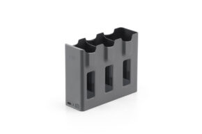 13e5f429d2e235939e6991c9300d49af@large The DJI Mavic 4 Pro Parallel Charging Hub is a grey, rectangular charging hub with three battery slots, each with vertical slots, and a charging port on the bottom left, shown with a plain white background.
