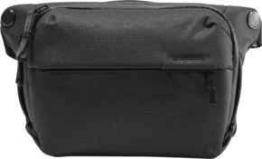 800q-01_123313 The Peak Design Everyday Sling 3L v2 in black is a messenger-style camera bag with a zipped front pocket, textured fabric and a sleek, minimalist look.