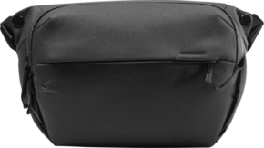 800q-01_123318 The black Peak Design Everyday Sling 10L v2 backpack features a modern see-through design, a zippered front pocket and adjustable straps that stand out against a monochrome background.