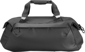 800q-01_123351 The black Peak Design Travel 65L Duffel has two short handles, a zip fastening and a sleek minimalist design that stands out against a white background.