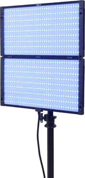 800q-01_127902 The Nanlite PavoSlim 240C RGBWW LED panel is a rectangular LED light on a stand that emits a bright blue light. It has a power cord on the back, and has two connected sections with rows of small LED bulbs on the surface.