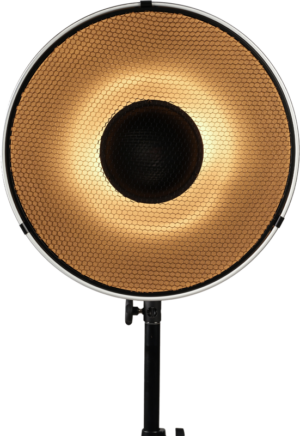800q-01_129902 The Nanlite Beauty Dish 40 cm reflector with honeycomb diffuser emits a warm golden glow and is mounted on a black base against a white background.