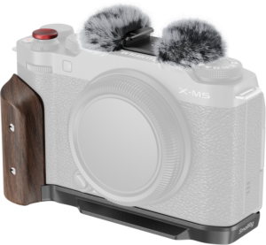 800q-01_133173 FUJIFILM X-M5 camera with SMALLRIG 5260 L-SHAPE mounting plate with wooden grip, red shutter button and two hair-covered microphone windscreens on top; black camera body is visible without lens attached.