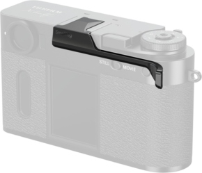 800q-01_133467 The SmallRig 5222 Thumb Grip for Fujifilm X Half Black attaches to the upper right corner of the silver camera body, improving grip and comfort. The grey camera highlights the added black thumb grip accessory.