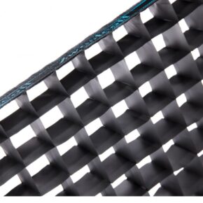 1535704602_002 A close-up of the Westcott 40-Degree Egg Crate Grid for Rapid Box Switch 1x3, showing its black, interlocking square structure with a visible blue stitched edge in the top left-hand corner.
