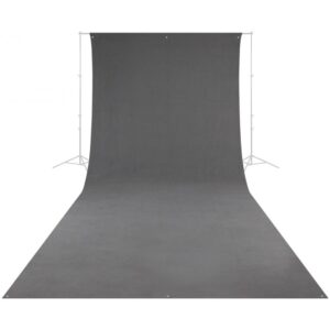 1602150372_601 The Westcott Wrinkle-Resistant Backdrop - Grey (270 x 610 cm) is vertically stretched and extends to the floor, supported by a metal frame with tripods on either side.