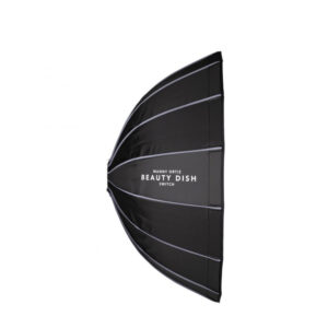 Screenshot The Westcott Beauty Dish Switch by Manny Ortiz (91 cm, Silver Interior) is fitted with silver rods and has "Manny Ortiz Beauty Dish Switch" printed on the black side, displayed against a white background.